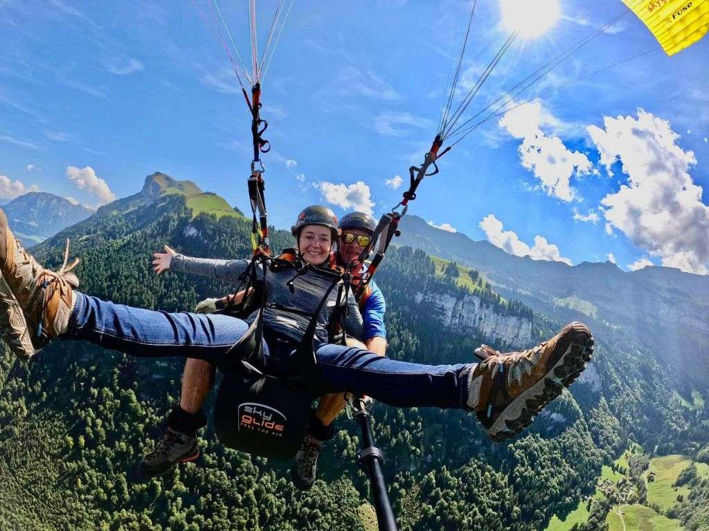 Paragliding with swiss alps in background