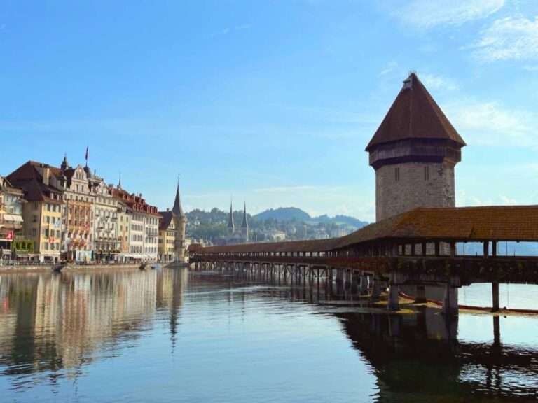 Chapel Bridge with tower and river on sunny day