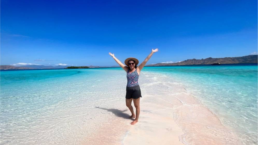 Standing on a sandbar with a Komodo Island boat tour.