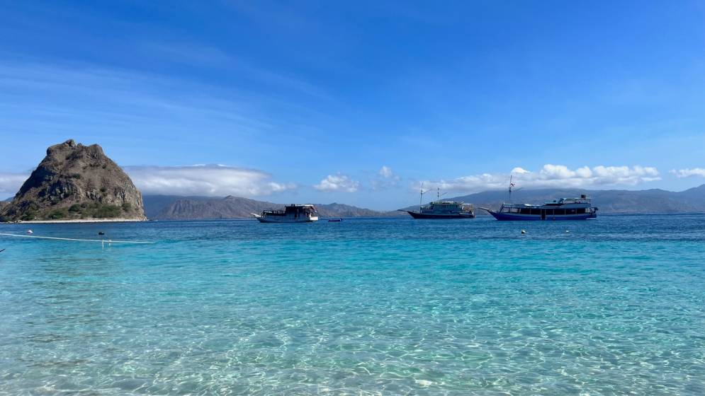 turquoise waters with island in background