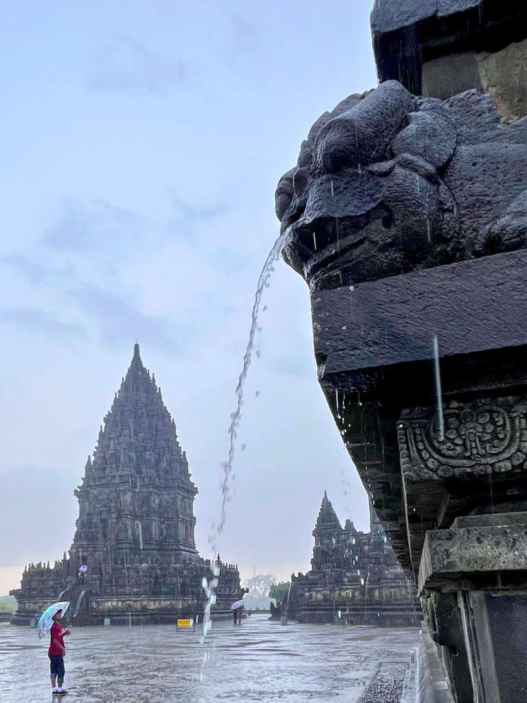 Rainwater coming out of the statue mouth at Prambanan Temple