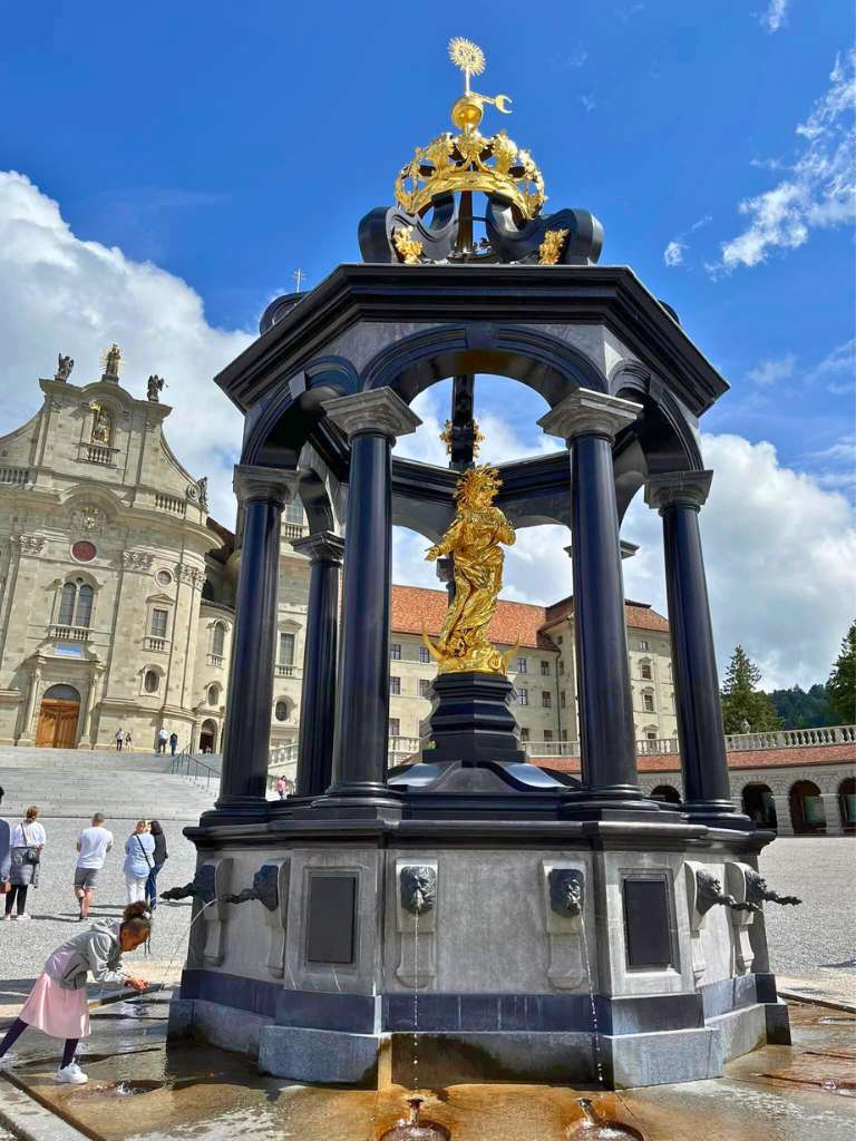 Fountain in front of abbey with Einsiedeln Black Madonna