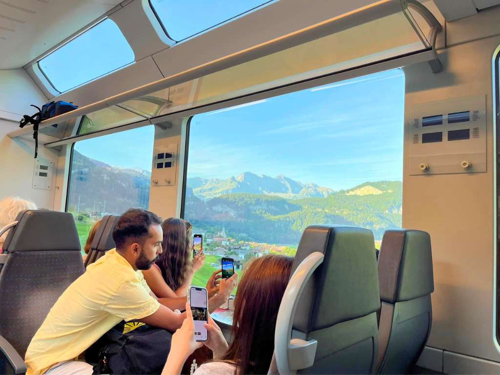 looking at swiss alps through train car window