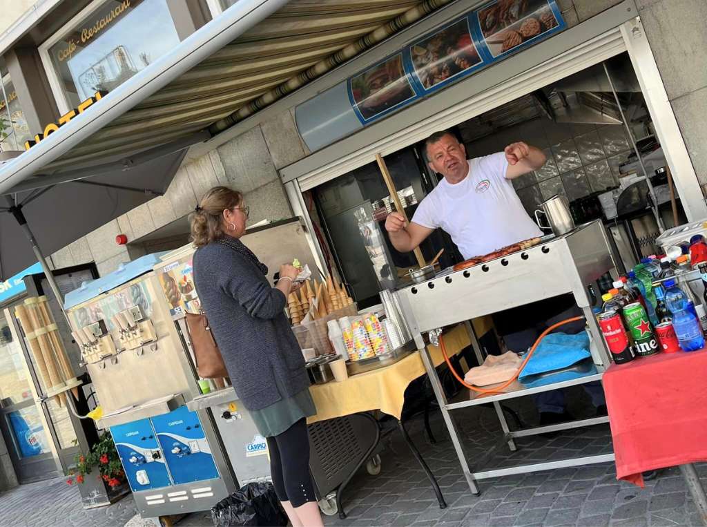 street vendor selling sausages outside Einsiedeln Black Madonna