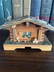 small wooden swiss chalet bank