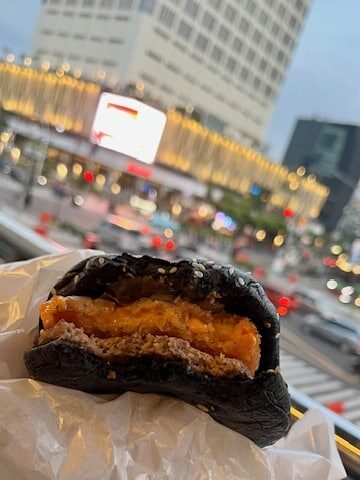 Korean inspired burger with black bun at McDonalds in Indonesia