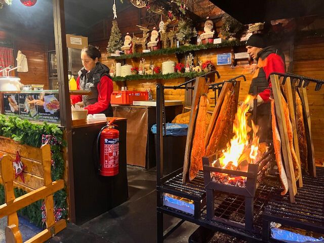 Christmas market smoked salmon over fire